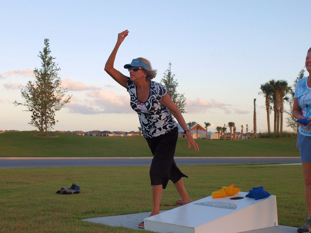 Woman playing cornhole