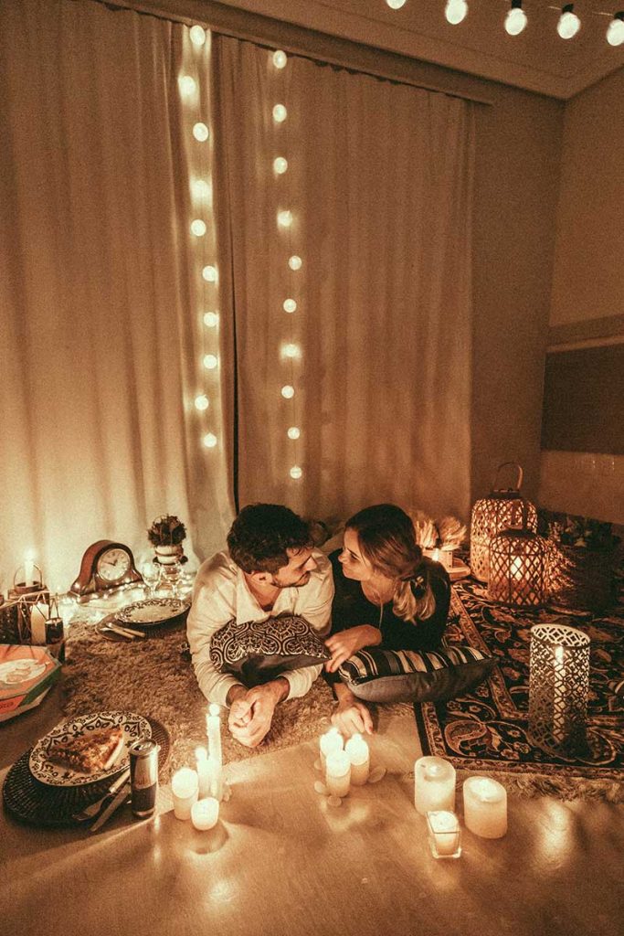 romantic indoor picnic candles and lights