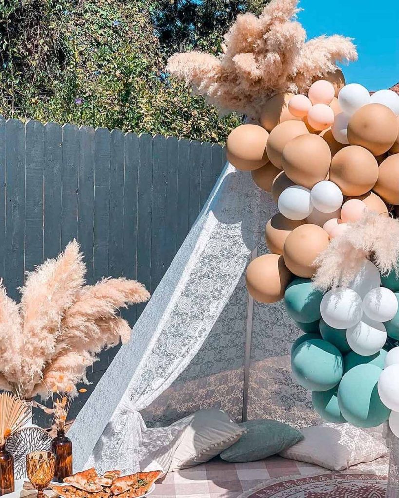 picnic tent decorated with balloons