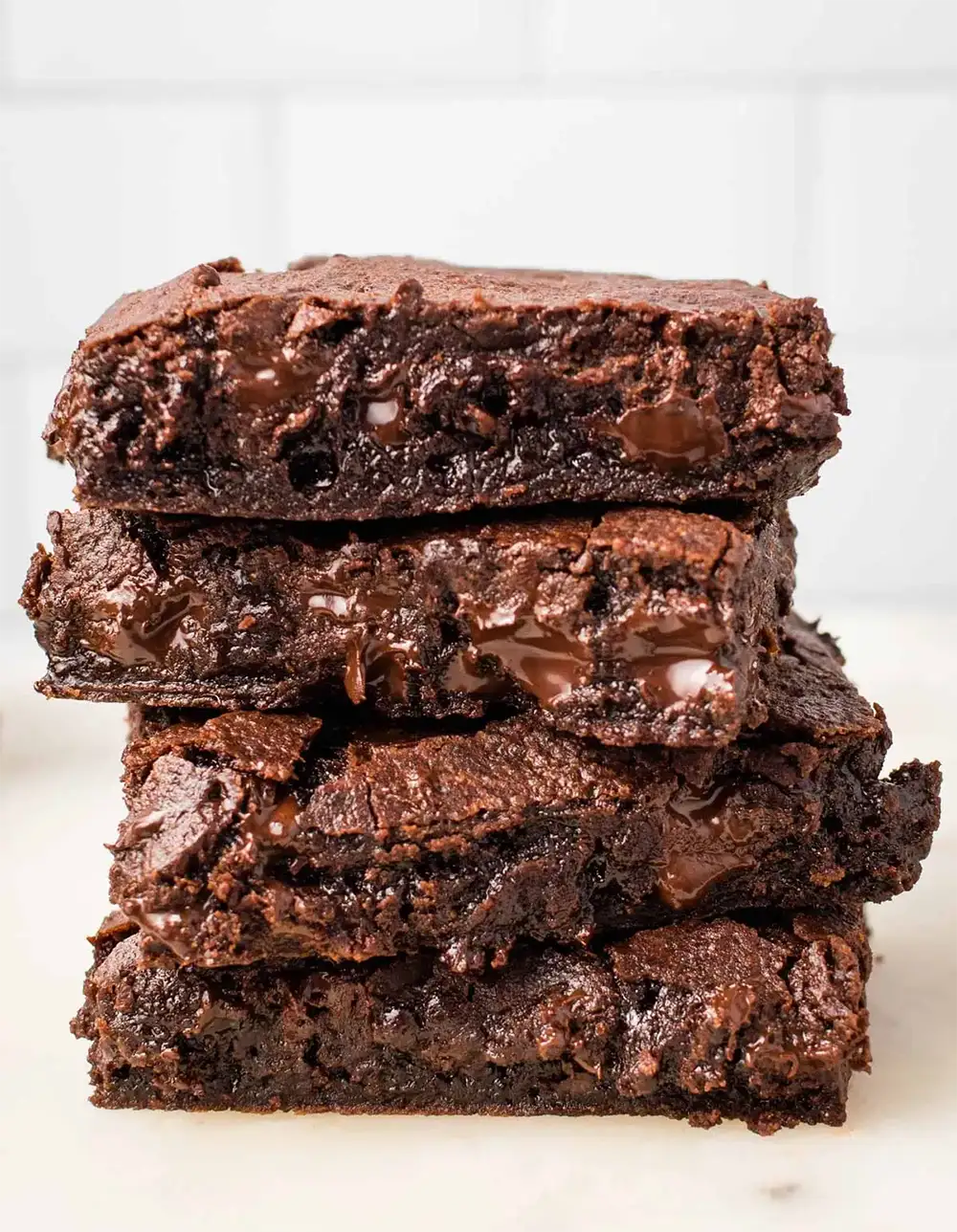 vegan chocolate brownies stacked on each other