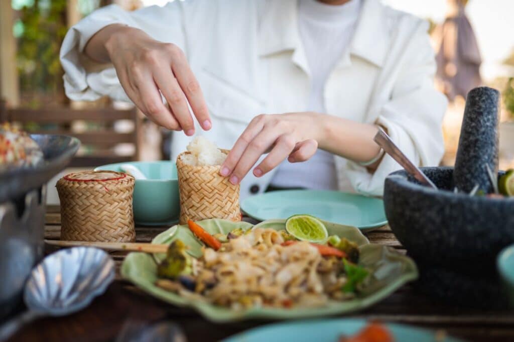 person eating warm rice