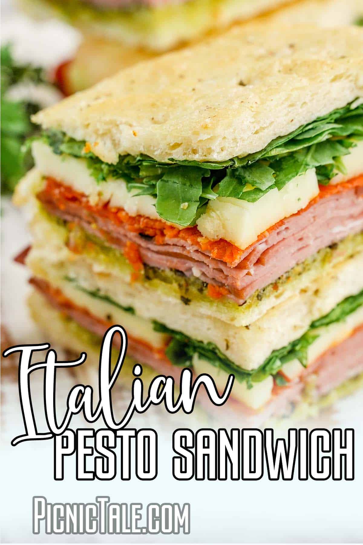 Close up of Italian Pesto Sandwich, with lettering on bottom.