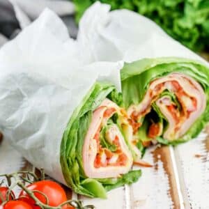 Close up of Lettuce Wrap Sandwich, wrapped in parchment paper.