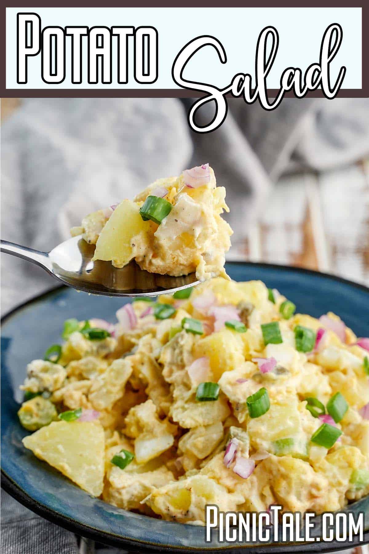 fork full of potato salad for a picnic with text which reads Potato Salad