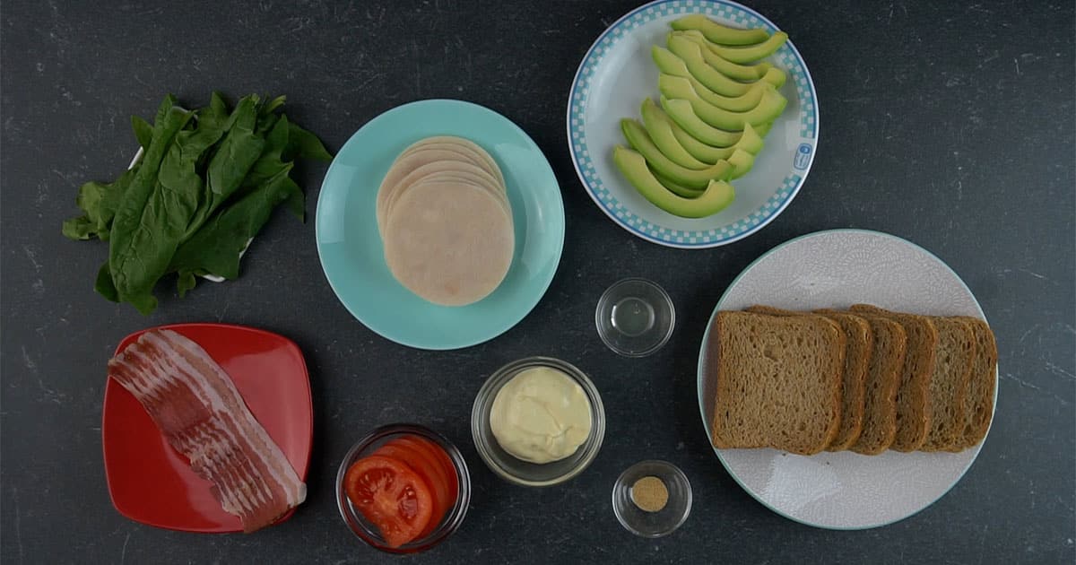 ingredients to make a Turkey Bacon Avocado Club Sandwich for a picnic