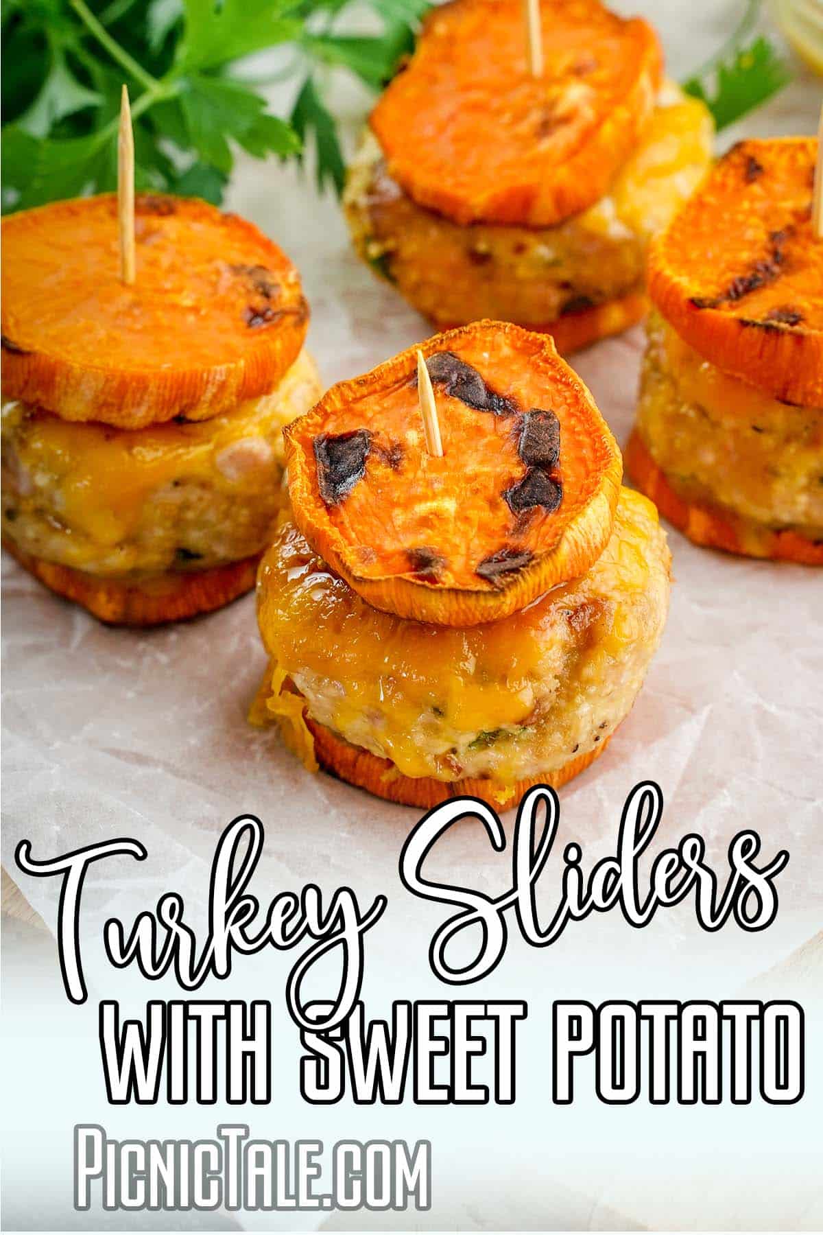 Turkey Sliders with Sweet Potato, Stacked Four on white Paper, parsley and Lettering on bottom.