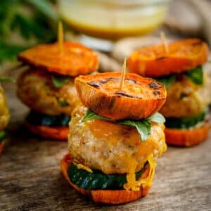 Turkey Sliders with Sweet Potato, On Fence board, background out of focus.
