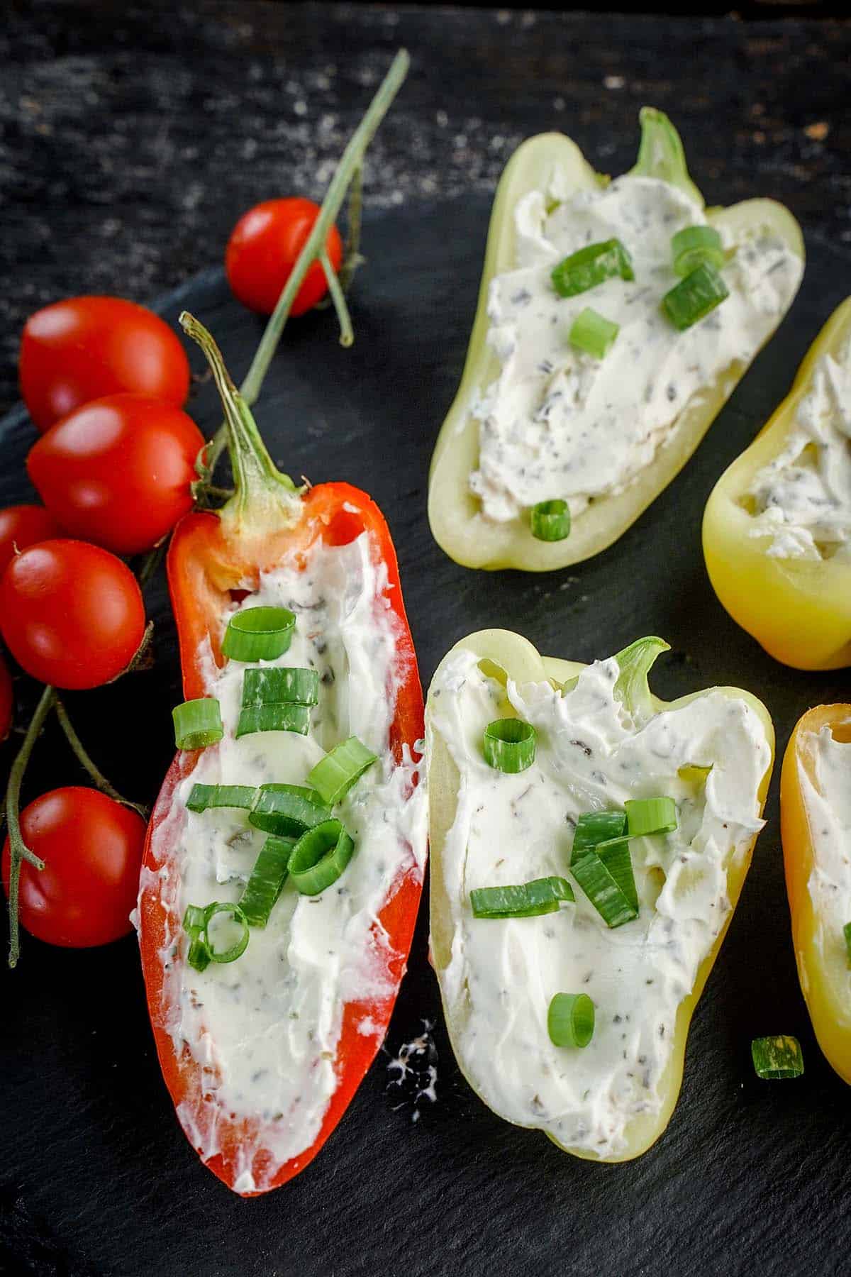 cheese stuffed baby peppers on a plate