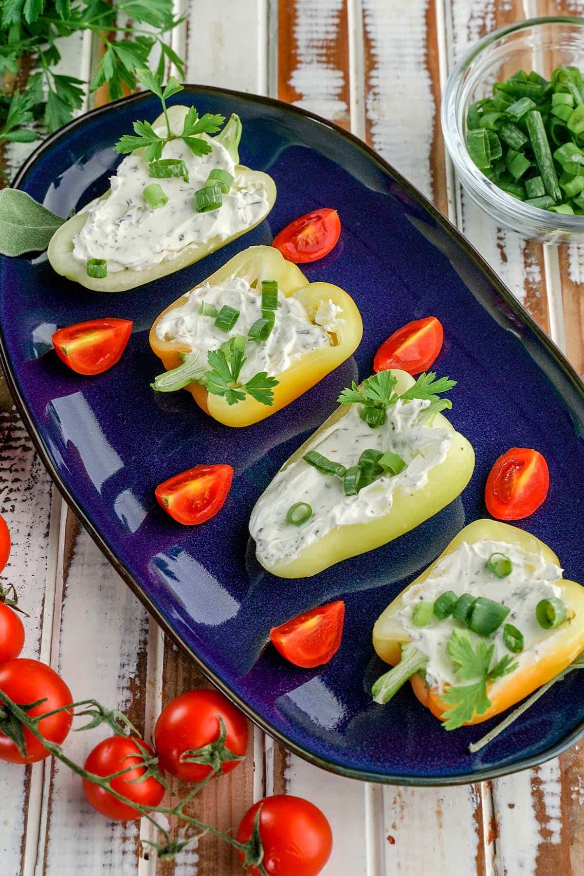 cheese stuffed baby peppers on a serving dish