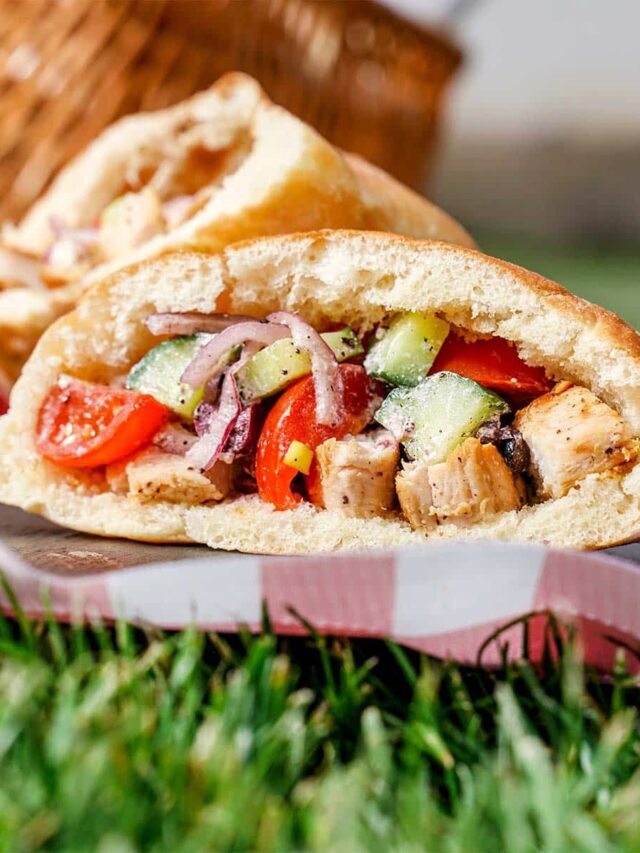 Greek Salad pockets, outside with grass showing.