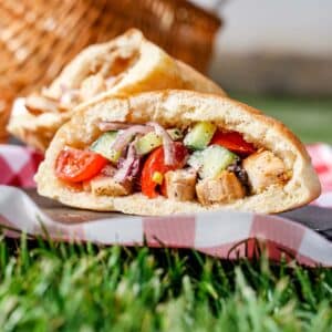 Greek Salad pockets, outside with grass showing.
