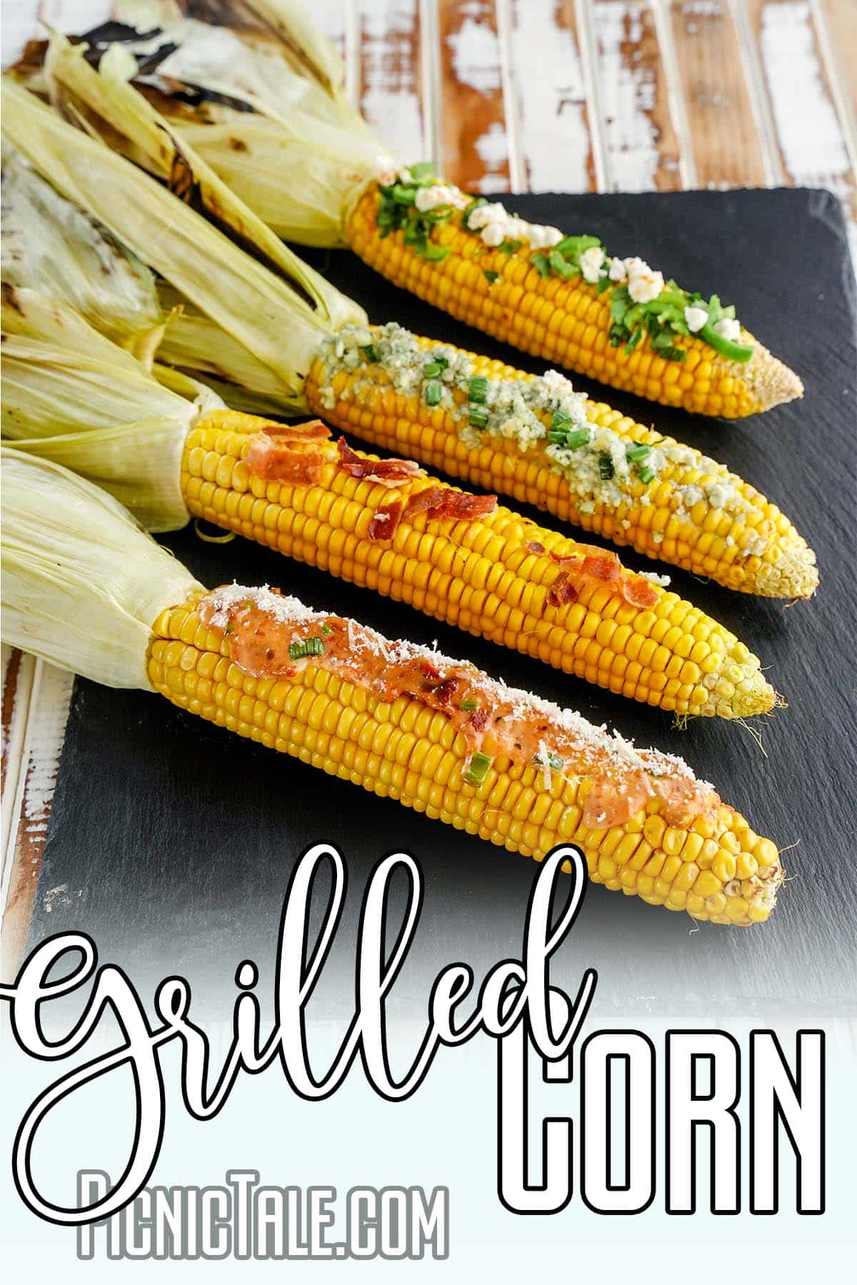 closeup of elote corn on the cob with text which reads grilled corn on the cob
