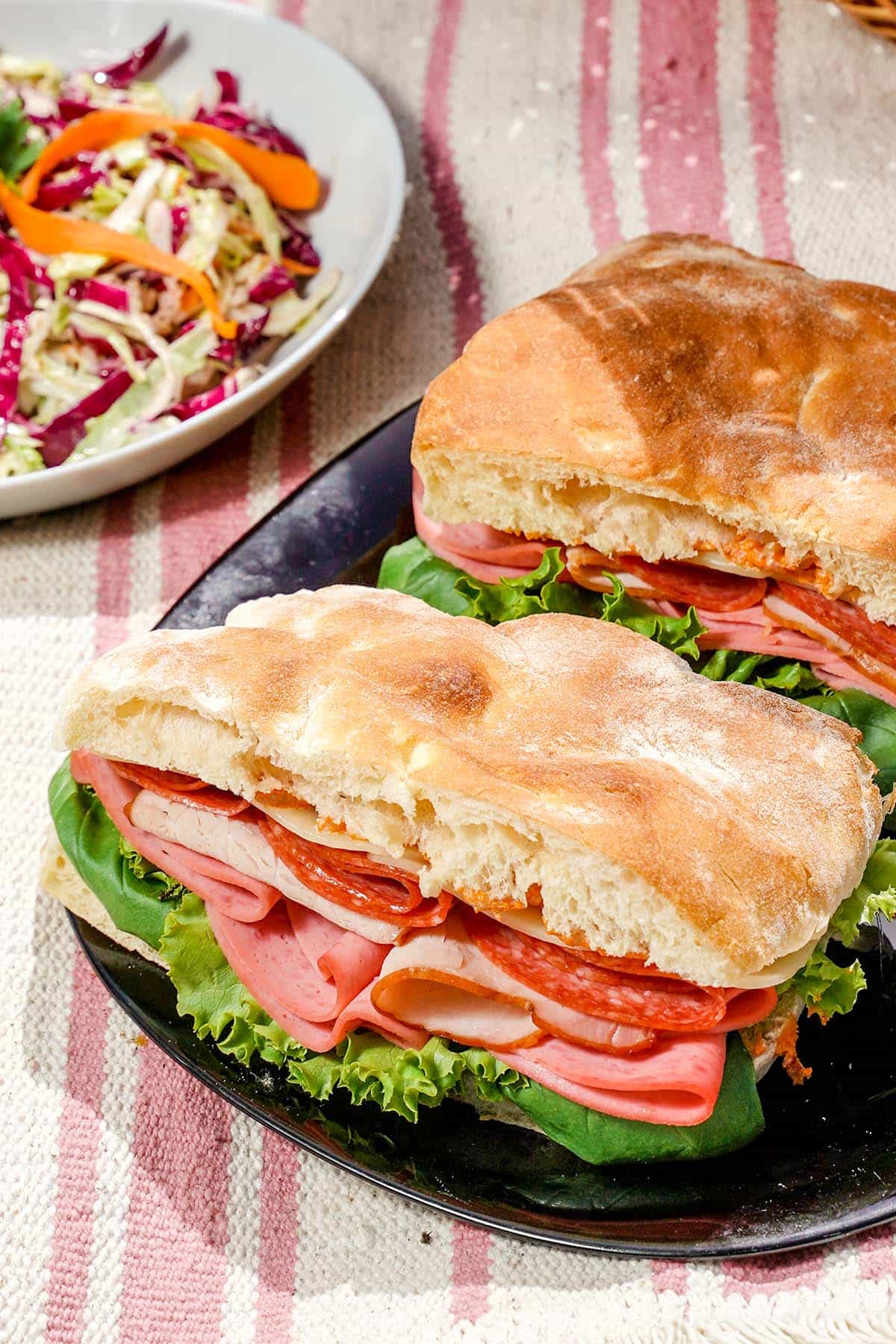 closeup of picnic sandwich with italian meats