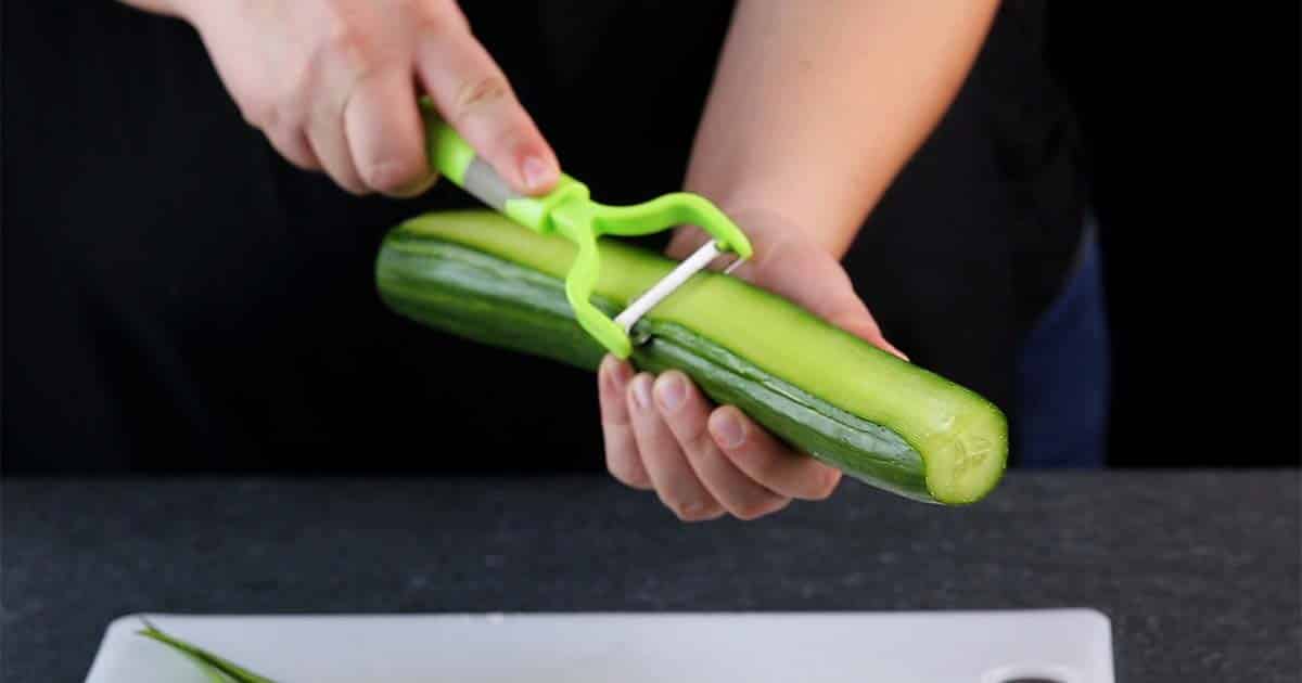peeling cucumber to make veggie sushi